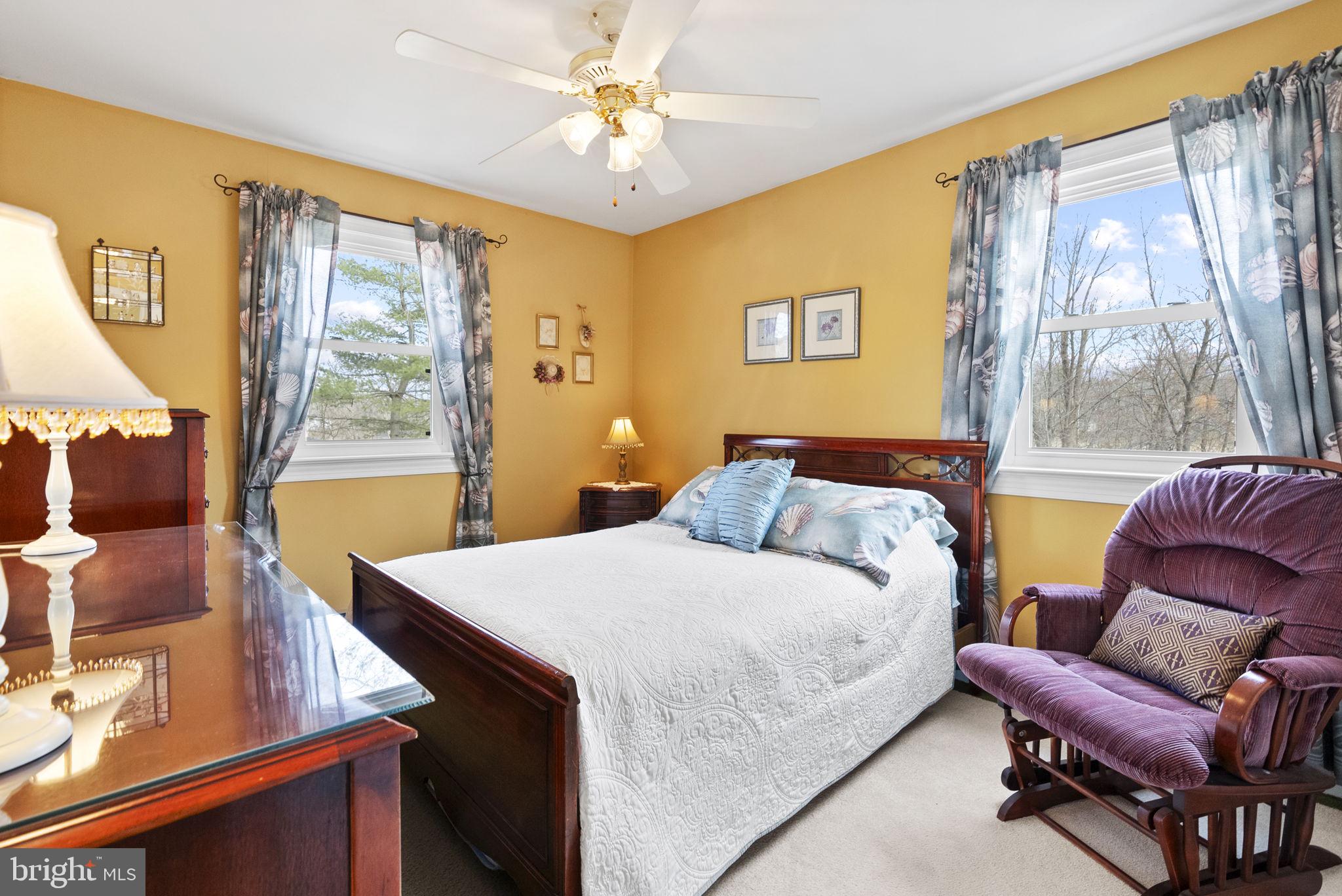 222 Brookside Circle Harleysville, PA 19438 - Photo 24 of 34 a bedroom with a bed and wooden floor