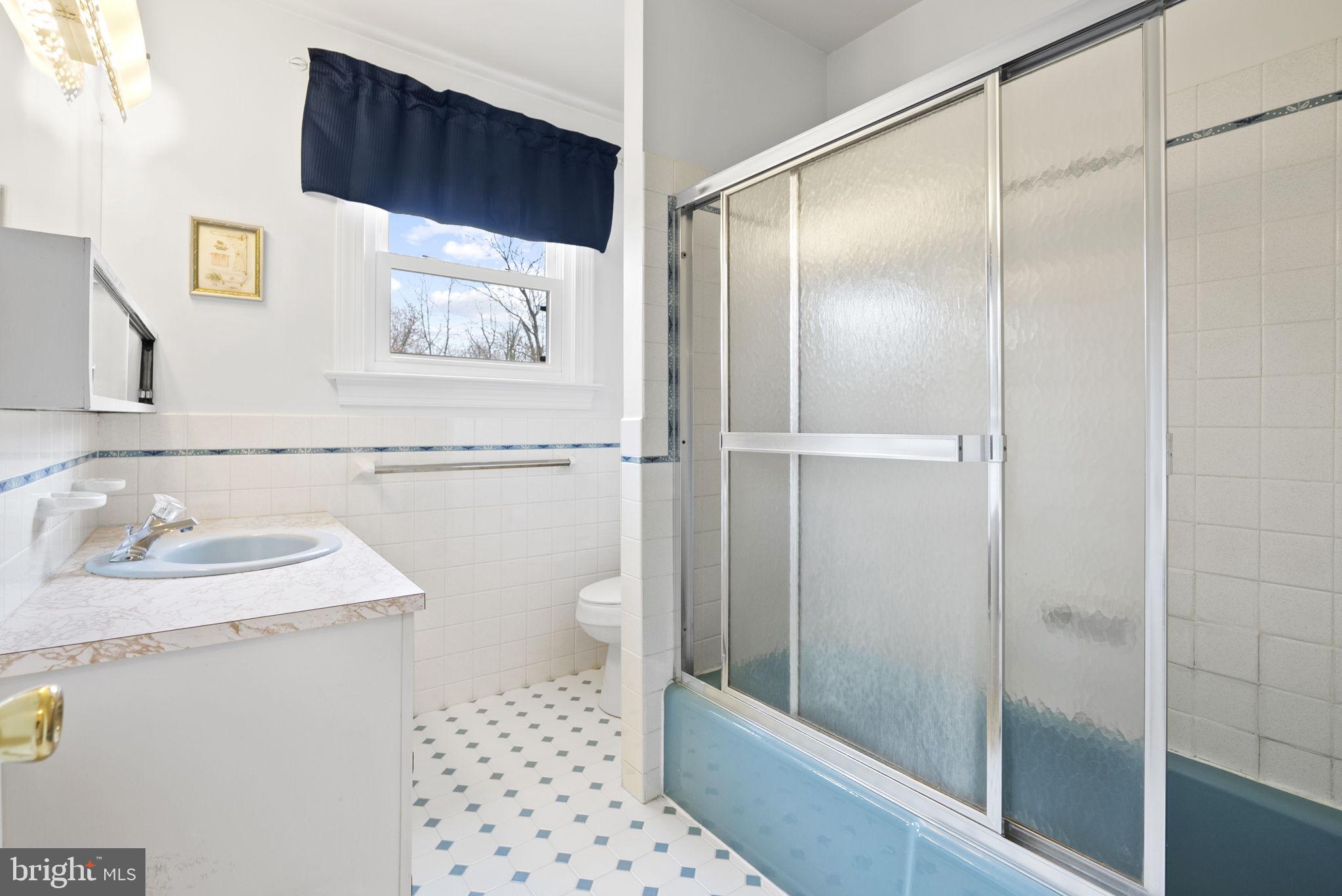 222 Brookside Circle Harleysville, PA 19438 - Photo 26 of 34 a bathroom with a sink a toilet and shower