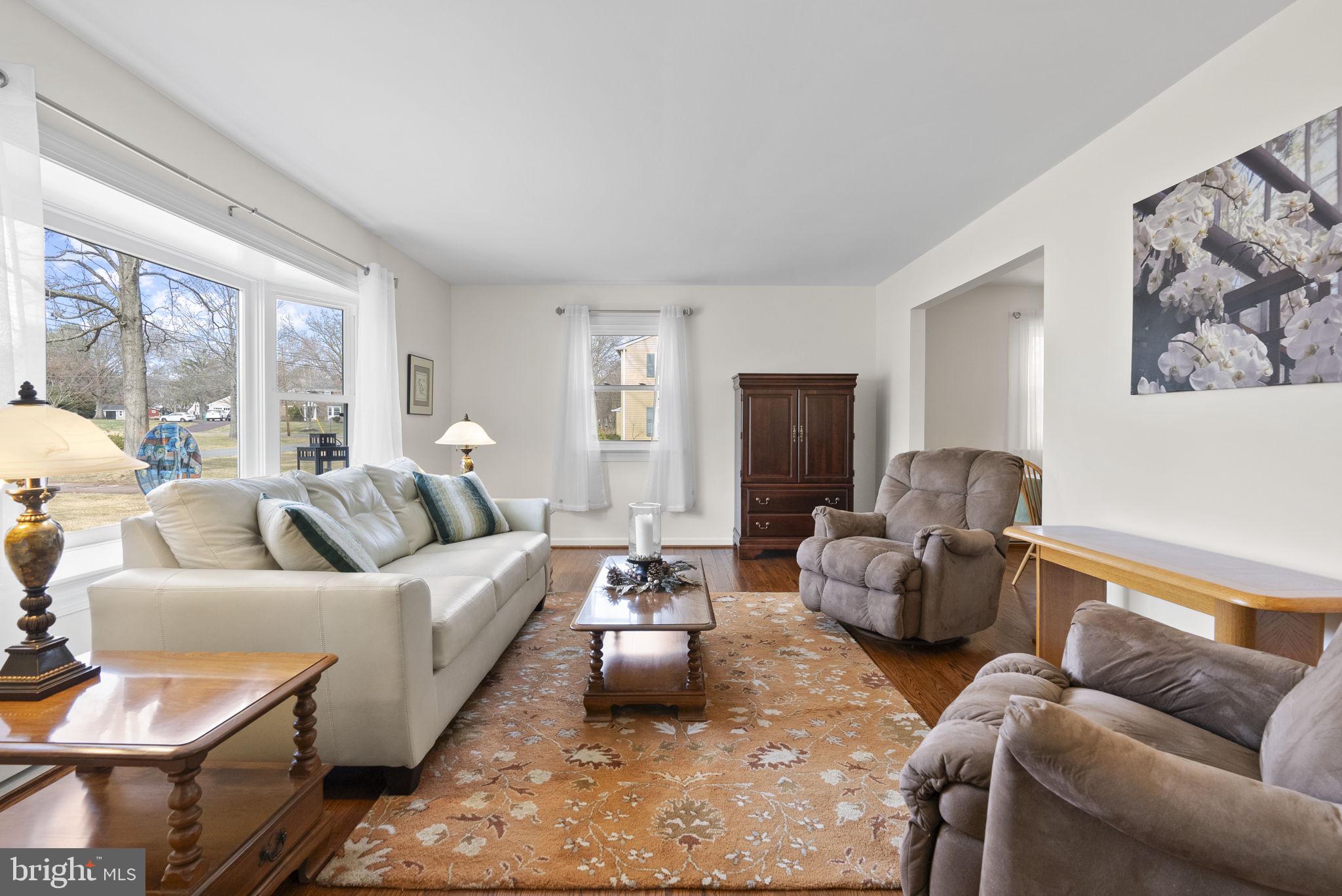 222 Brookside Circle Harleysville, PA 19438 - Photo 6 of 34 a living room with furniture and a flat screen tv