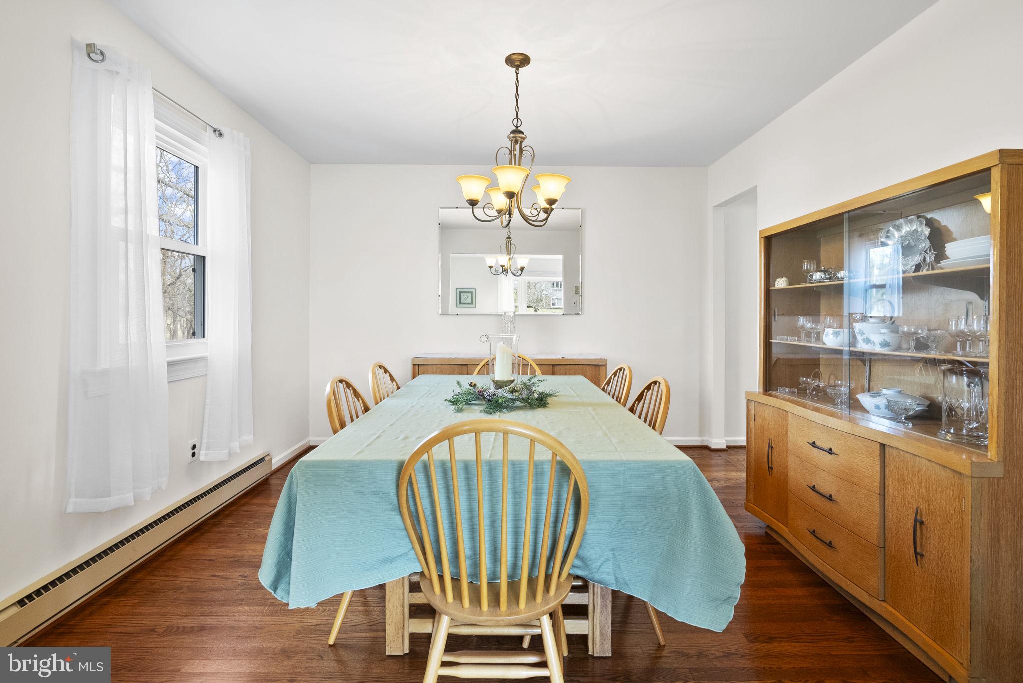 222 Brookside Circle Harleysville, PA 19438 - Photo 8 of 34 a dining room with furniture a chandelier and wooden floor