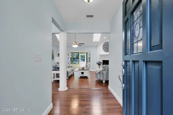 a view of a dining room with furniture and wooden floor