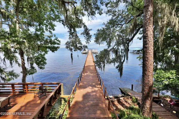 a house that has a tree in front of it