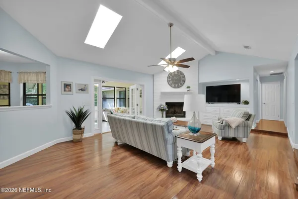 a bedroom with a bed and a ceiling fan