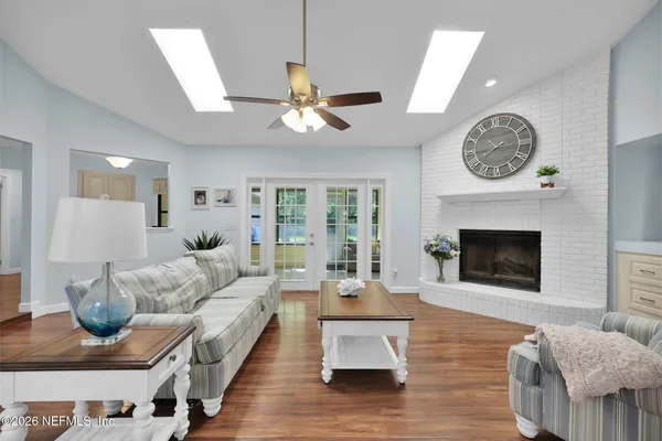 a bedroom with a bed a large window with outer view and balcony view