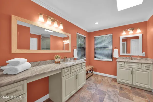 a view of green field with trees in the background