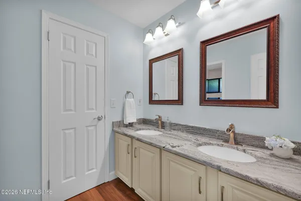 an aerial view of a house with a yard basket ball court and outdoor seating