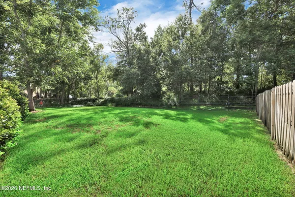 a view of a swimming pool with a yard