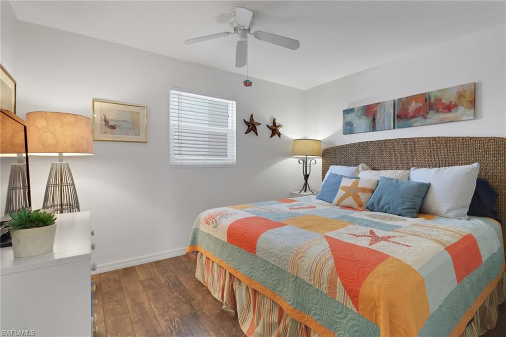1021 3rd Street South, Unit 306 Naples, FL 34102 - Photo 21 of 24 a bedroom with double bed and a window