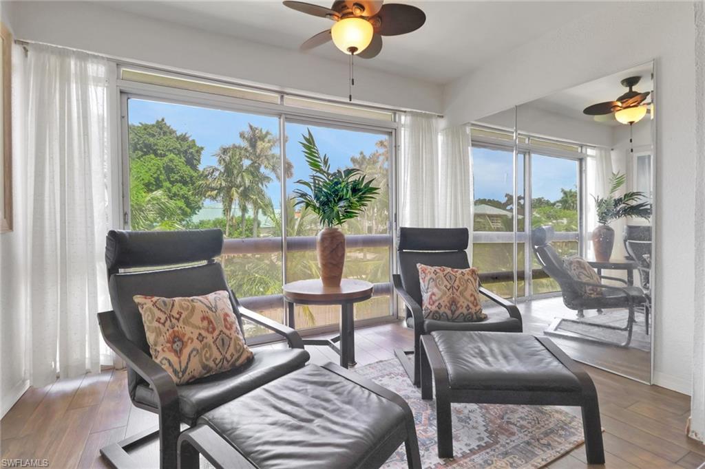 1021 3rd Street South, Unit 306 Naples, FL 34102 - Photo 3 of 24 a living room with furniture and a window
