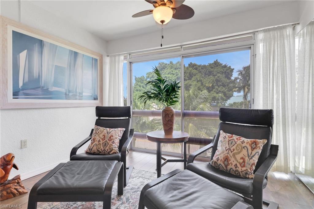 1021 3rd Street South, Unit 306 Naples, FL 34102 - Photo 4 of 24 a living room with furniture and a window