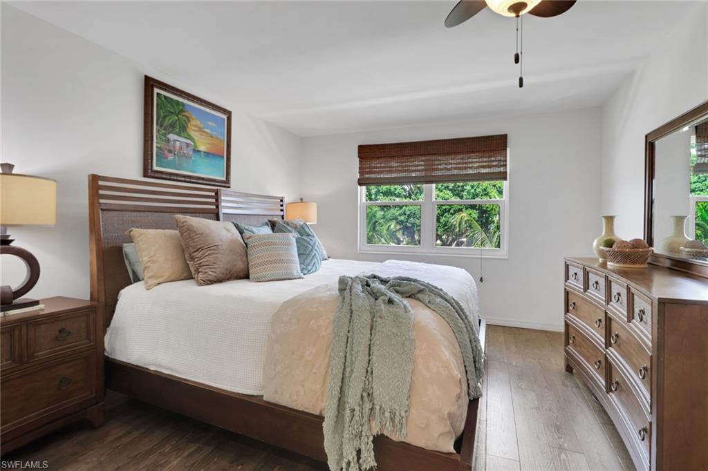 1021 3rd Street South, Unit 306 Naples, FL 34102 - Photo 5 of 24 a bed room with a bed and a television