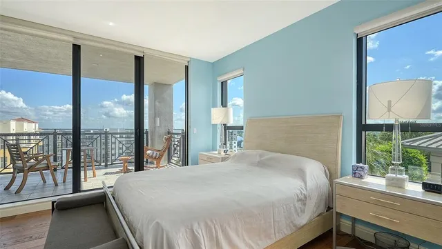 a spacious bedroom with a bed and a couch