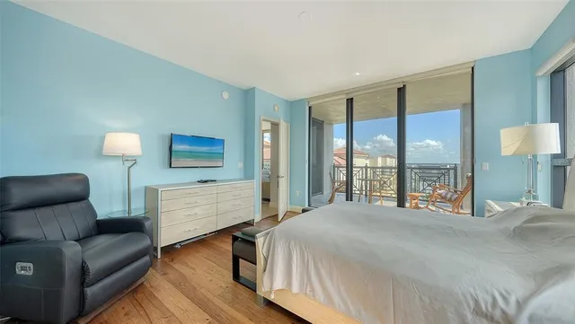 a bathroom with double vanity sinks and a large mirror