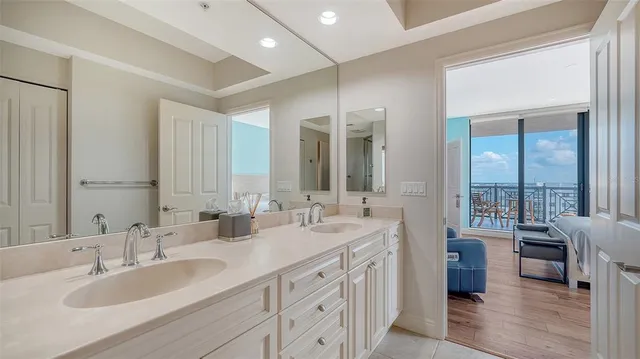 a view of a dining room with furniture wooden floor and chandelier