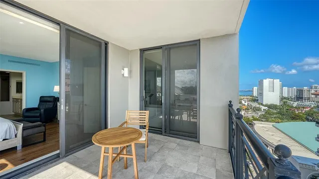 a kitchen with granite countertop a refrigerator and a stove top oven