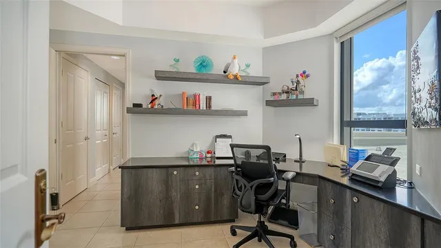 a bedroom with bed and wooden floor