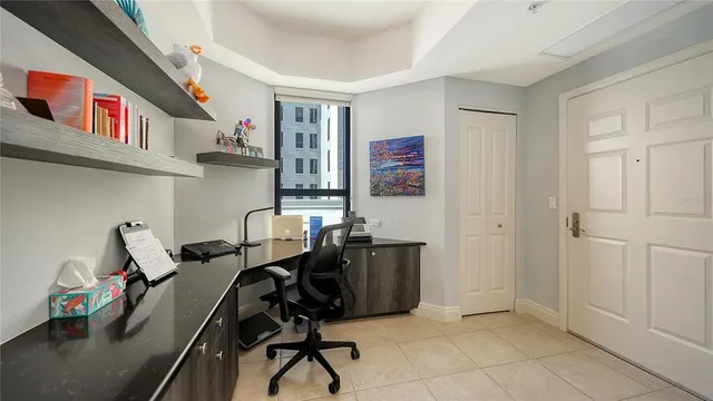 a bathroom with a bathtub shower sink vanity mirror and toilet