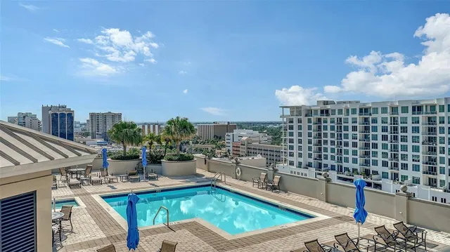 a living room with furniture and large window