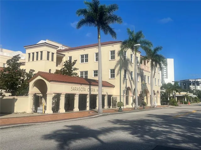 a brick building with a sign on it