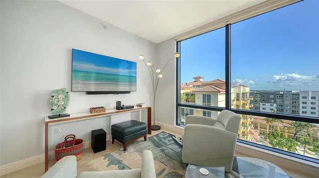 a living room with furniture and a lamp