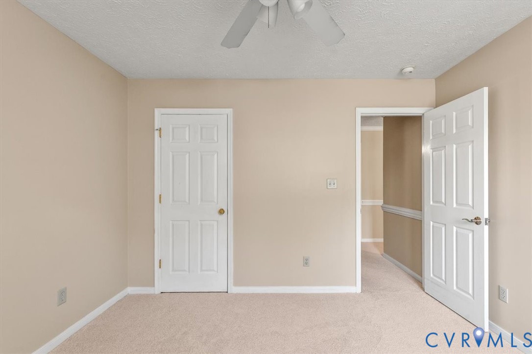 1437 Palmore Road Powhatan, VA 23139 - Photo 27 of 60 Spacious room featuring neutral carpeting and ligh