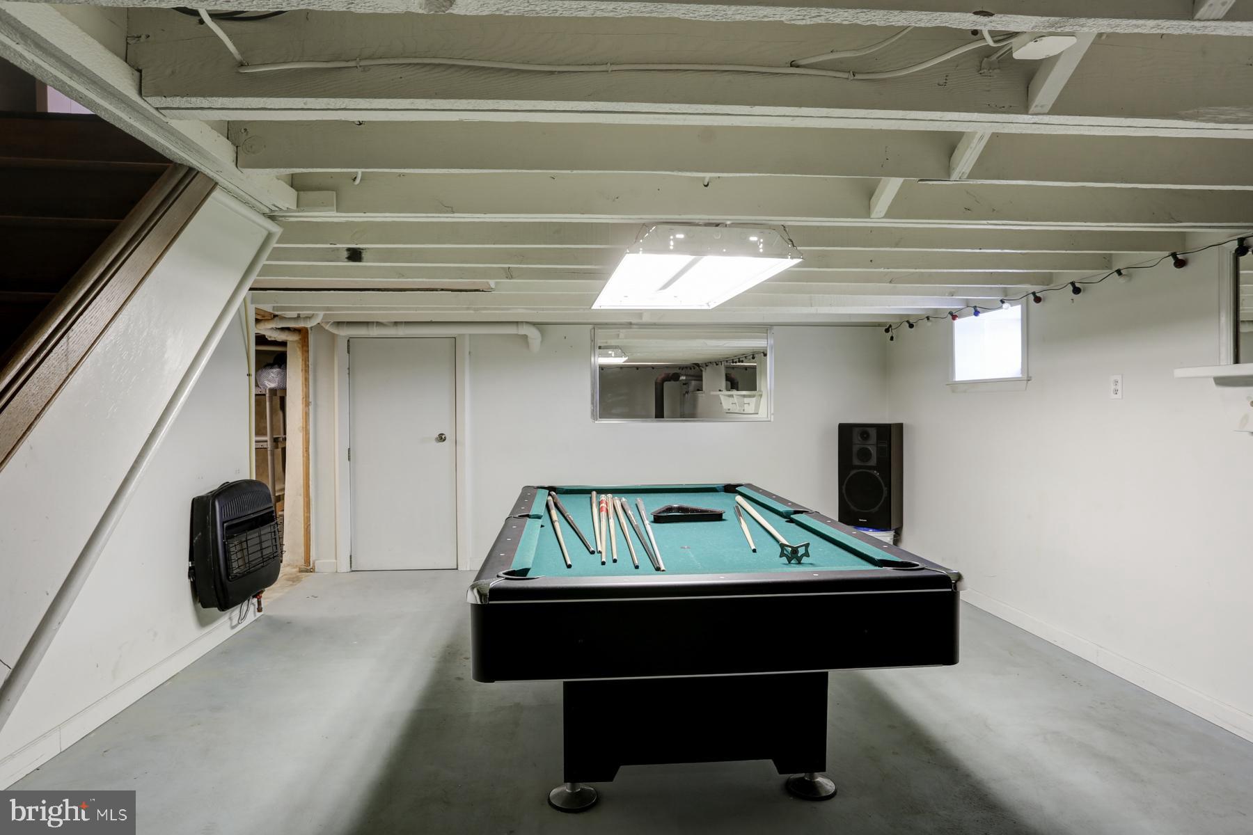 416 Ebenezer Road Lebanon, PA 17046 - Photo 22 of 32 Basement man cave / game room with coal stove.