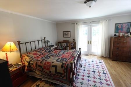 2324 State Street Santa Barbara, CA 93105 - Photo 3 of 11 a bedroom with a bed and wooden floor