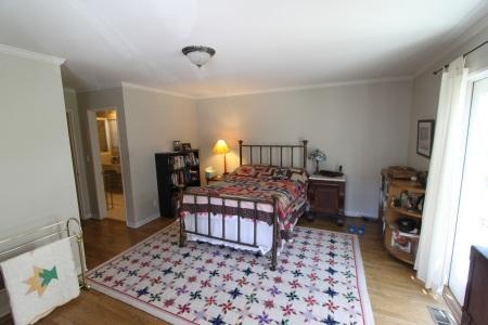 2324 State Street Santa Barbara, CA 93105 - Photo 4 of 11 a bedroom with a bed and wooden floor