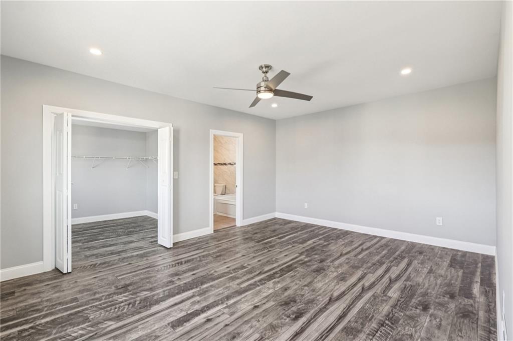 5256 Wickliff Street Pittsburgh, PA 15201 - Photo 28 of 49 an empty room with wooden floor and ceiling fan