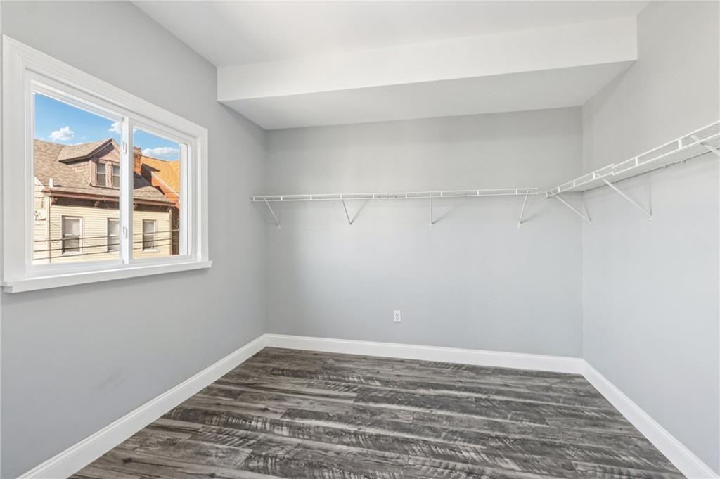 5256 Wickliff Street Pittsburgh, PA 15201 - Photo 29 of 49 a view of a room with wooden floor and fan