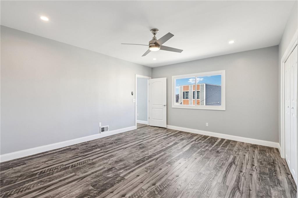 5256 Wickliff Street Pittsburgh, PA 15201 - Photo 30 of 49 a view of empty room with wooden floor and fan