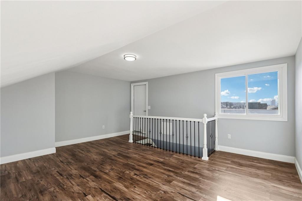 5256 Wickliff Street Pittsburgh, PA 15201 - Photo 36 of 49 a view of a room with wooden floor and windows