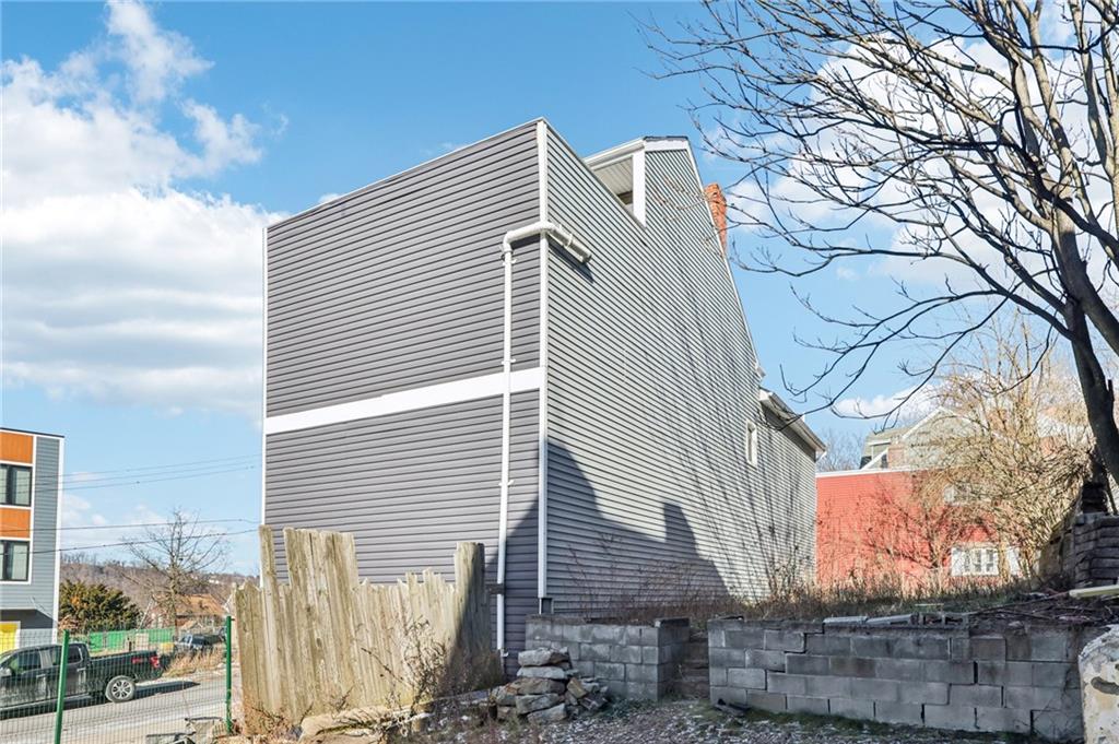 5256 Wickliff Street Pittsburgh, PA 15201 - Photo 45 of 49 a view of a house with a snow