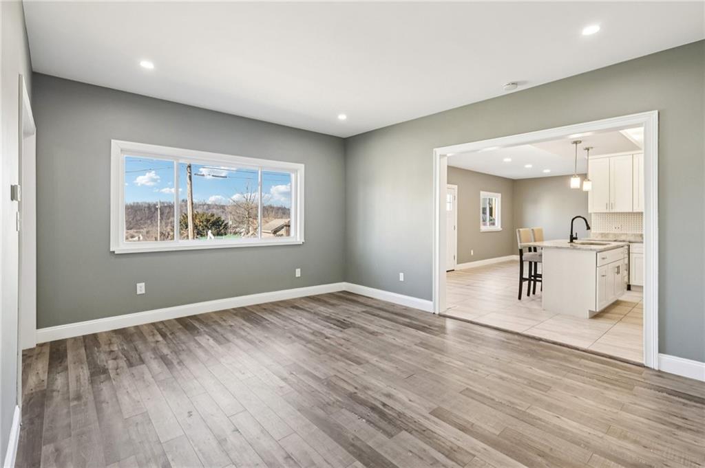 5256 Wickliff Street Pittsburgh, PA 15201 - Photo 10 of 49 a view of empty room with wooden floor and window