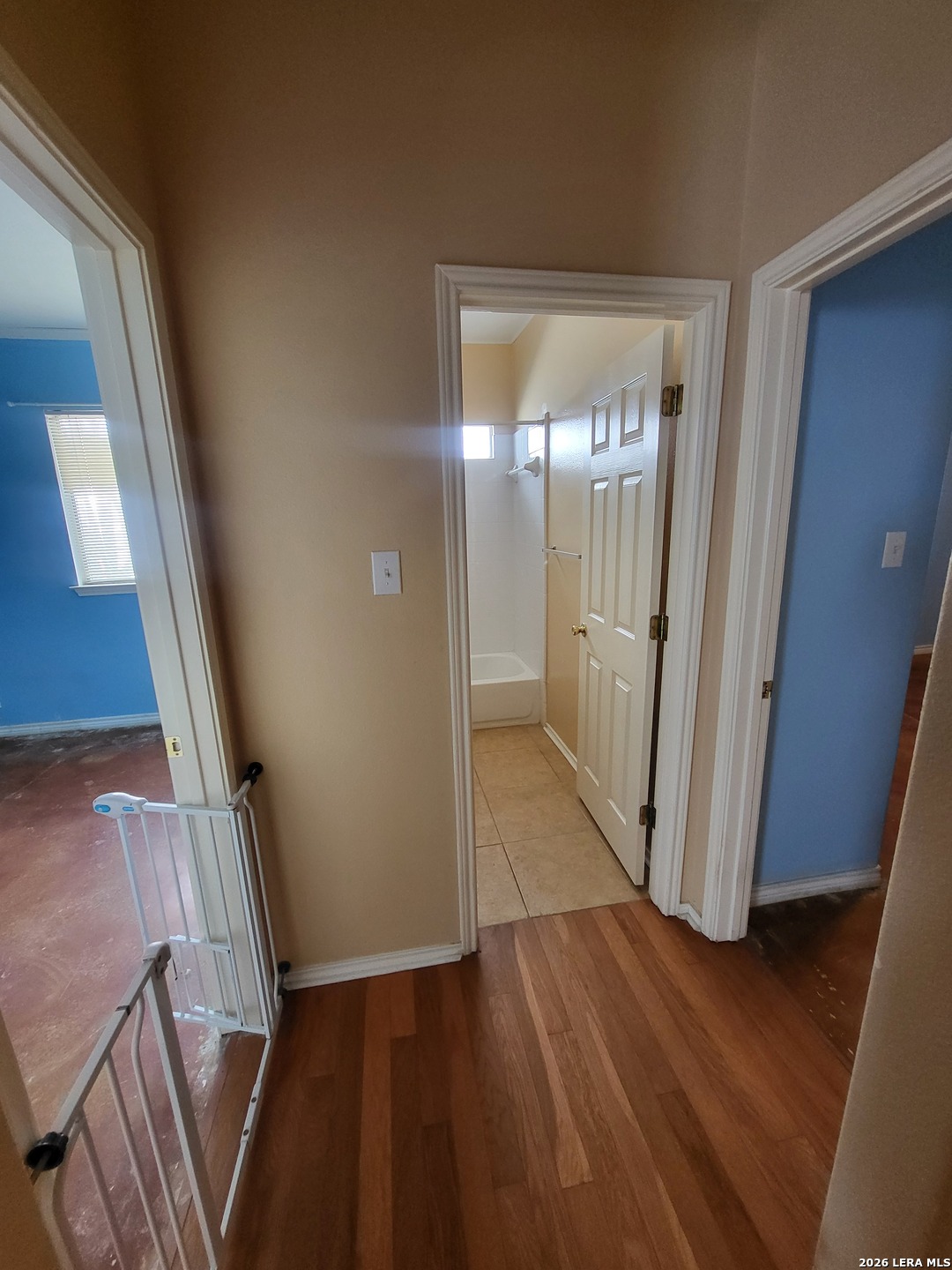 5411 Excello Path San Antonio, TX 78247 - Photo 19 of 29 a view of an empty room with wooden floor and a window