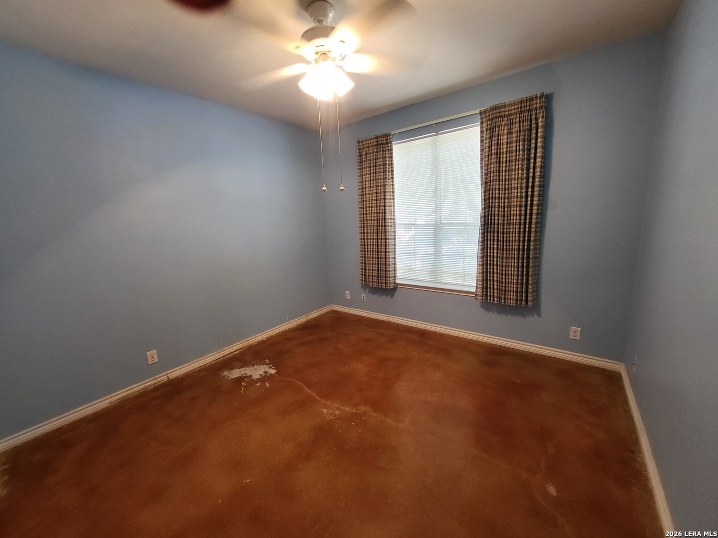 5411 Excello Path San Antonio, TX 78247 - Photo 23 of 29 an empty room with windows and chandelier fan