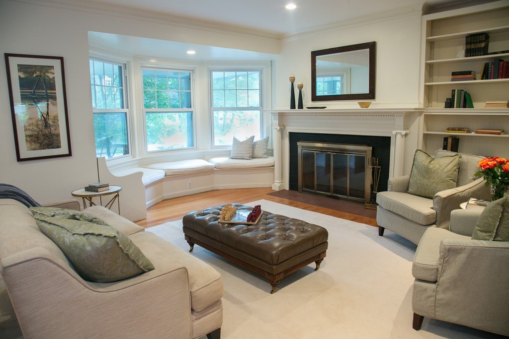 51 Salisbury Road Brookline, MA 02445 - Photo 3 of 7 a living room with furniture and a fireplace
