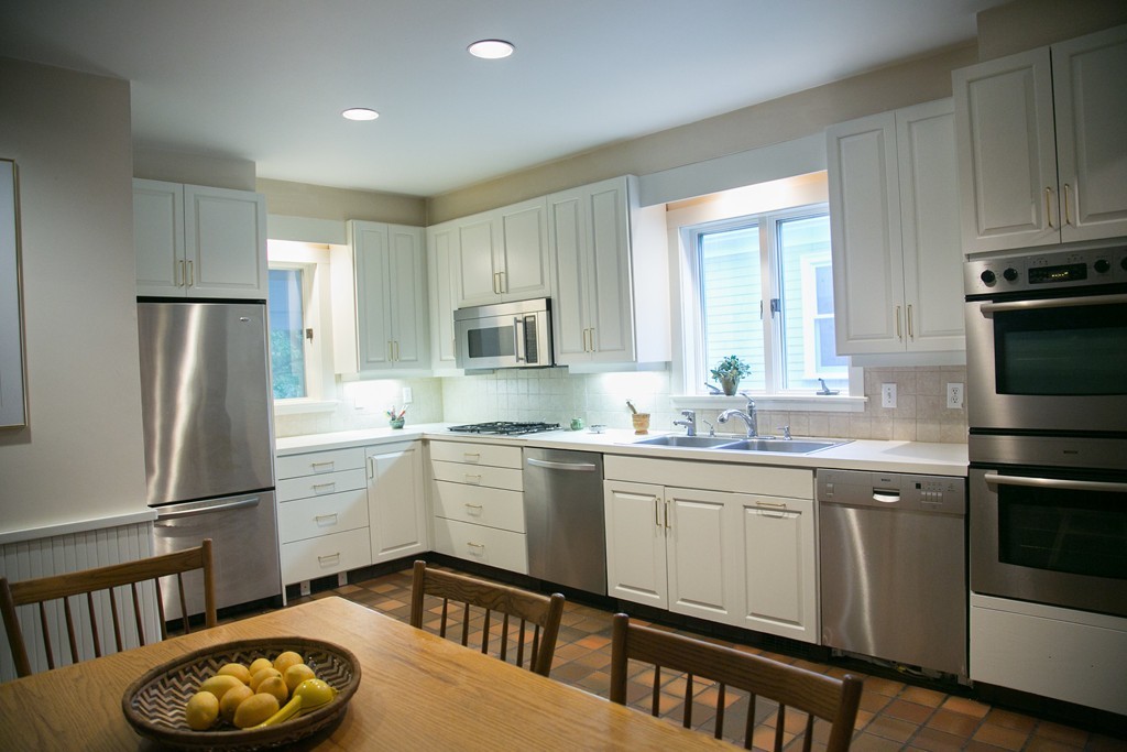 51 Salisbury Road Brookline, MA 02445 - Photo 4 of 7 a kitchen with a sink appliances and cabinets