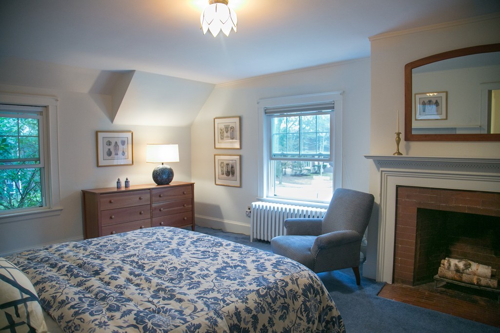 51 Salisbury Road Brookline, MA 02445 - Photo 7 of 7 a bedroom with a bed and a fireplace
