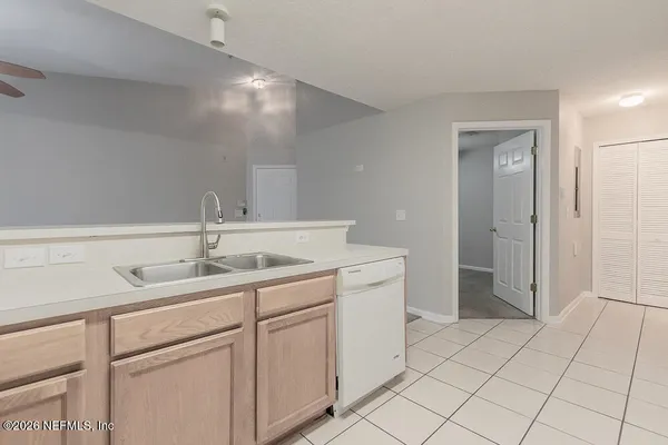 a bathroom with a sink toilet and a mirror