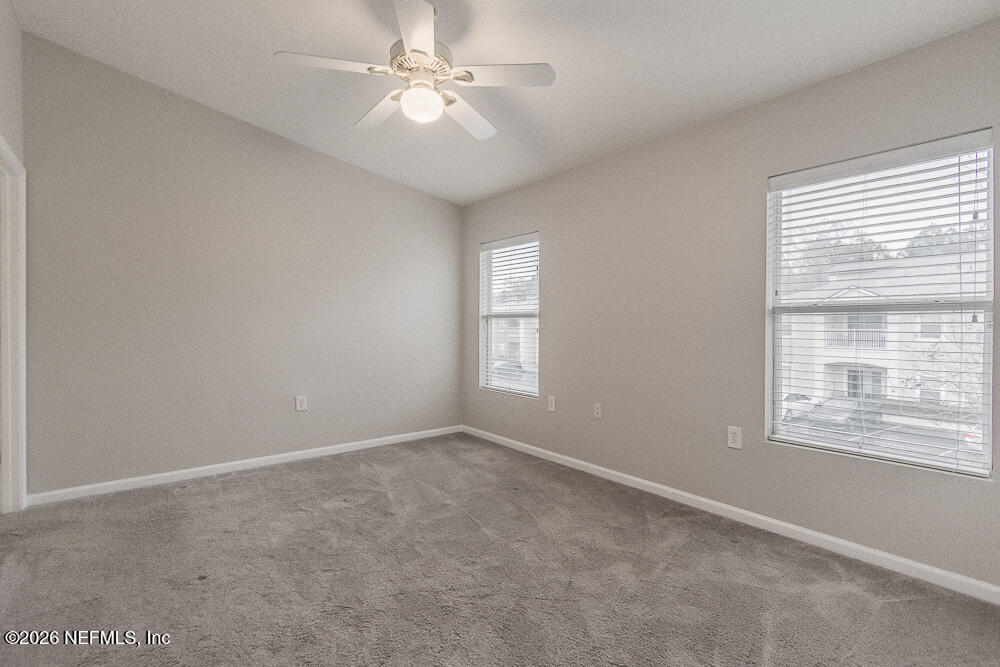 7920 Merrill Road, Unit 1511 Jacksonville, FL 32277 - Photo 23 of 32 a view of an empty room with a window