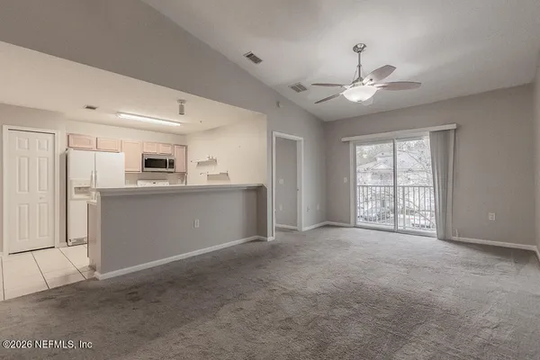 a view of a kitchen with washer and dryer