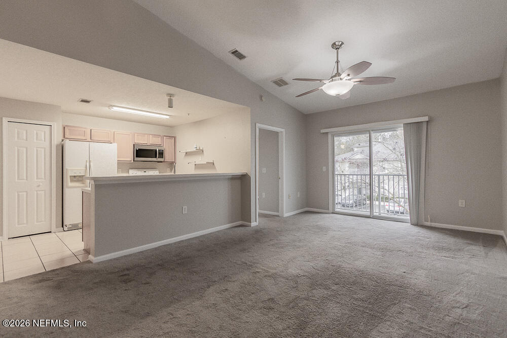 7920 Merrill Road, Unit 1511 Jacksonville, FL 32277 - Photo 3 of 32 a view of an empty room with a window