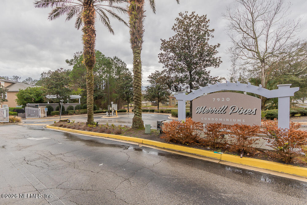 7920 Merrill Road, Unit 1511 Jacksonville, FL 32277 - Photo 31 of 32 a view of a street with a building and a street sign