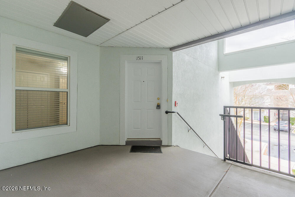 7920 Merrill Road, Unit 1511 Jacksonville, FL 32277 - Photo 8 of 32 a view of an empty room with a window