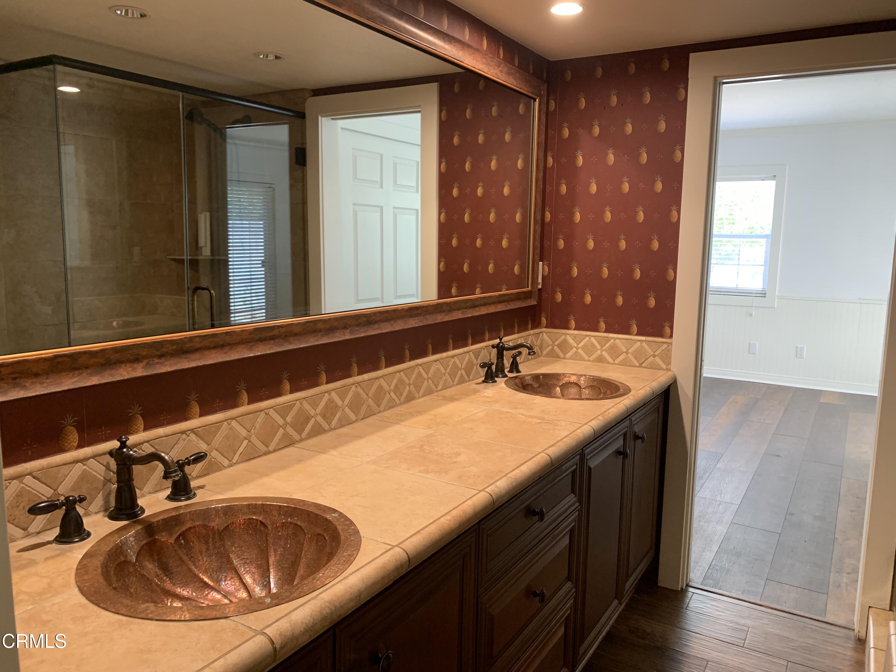 6009 La Cumbre Road Somis, CA 93066 - Photo 15 of 29 a bathroom with a sink and a mirror