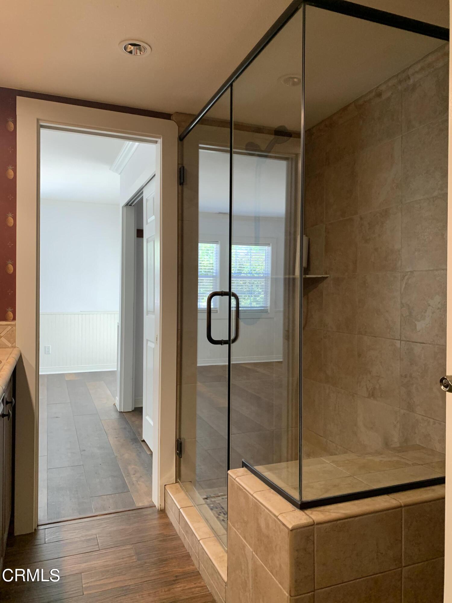 6009 La Cumbre Road Somis, CA 93066 - Photo 16 of 29 a bathroom with a glass shower door
