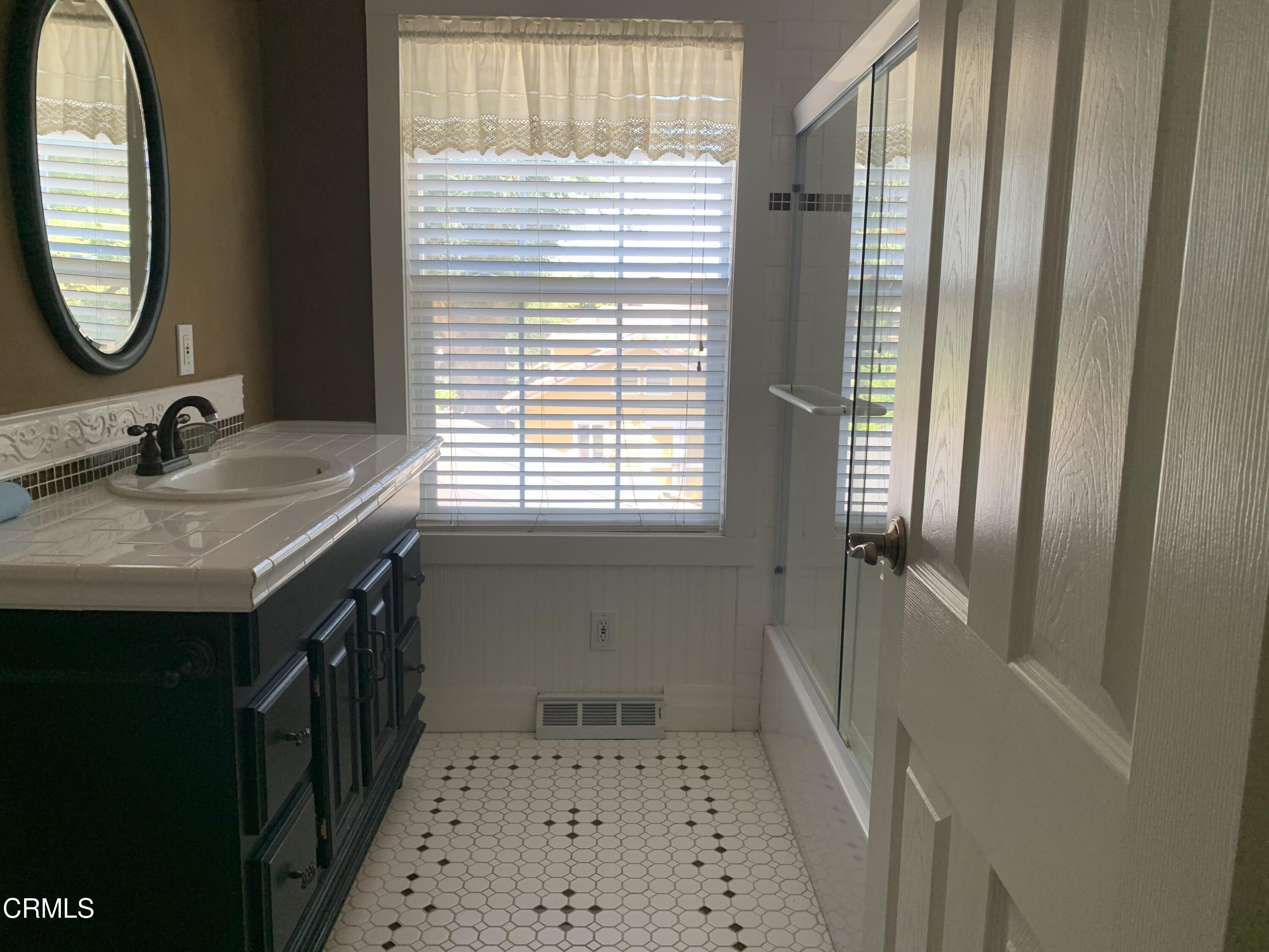 6009 La Cumbre Road Somis, CA 93066 - Photo 19 of 29 a bathroom with a sink a toilet and a mirror