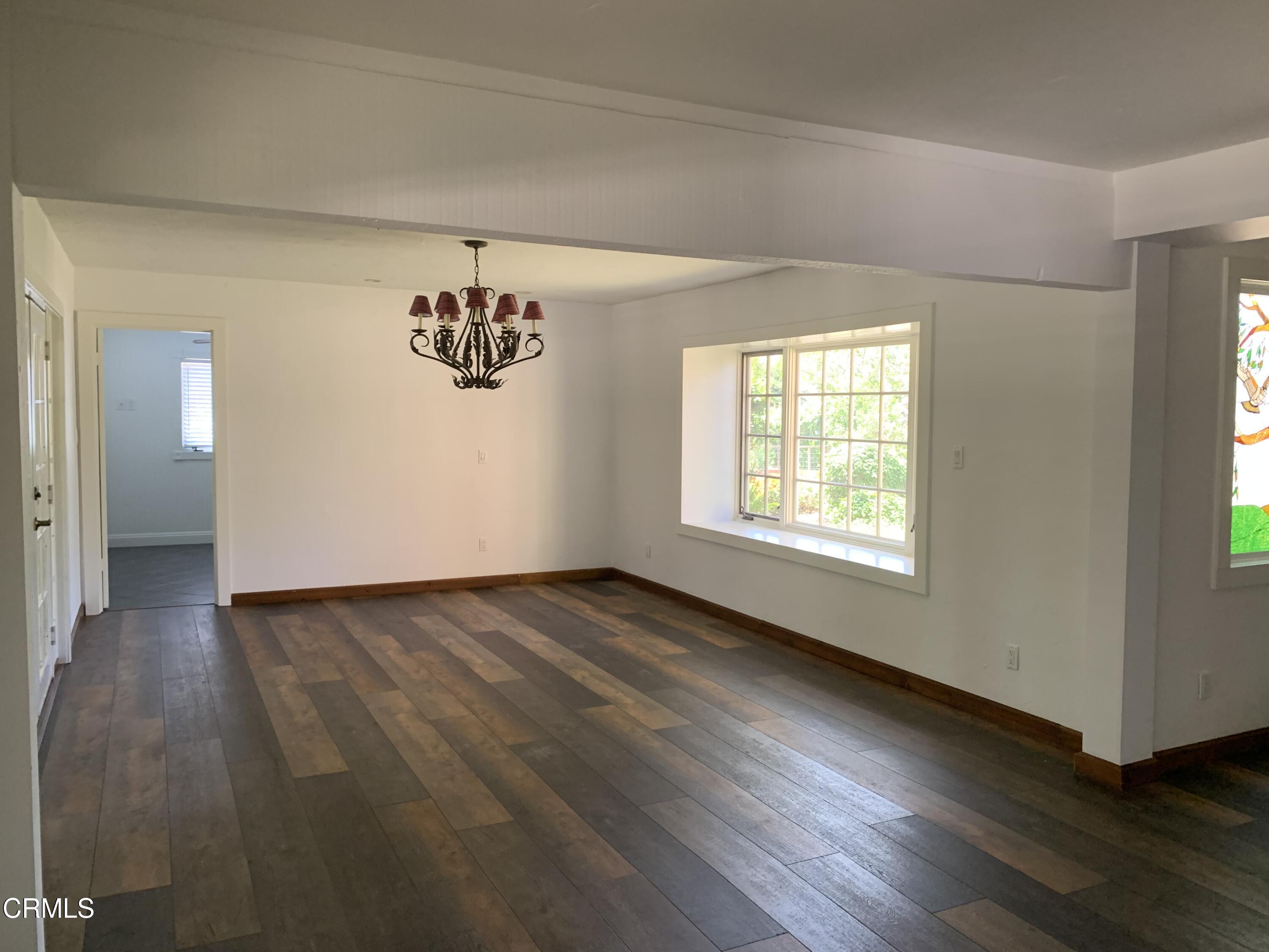 6009 La Cumbre Road Somis, CA 93066 - Photo 8 of 29 an empty room with wooden floor and windows
