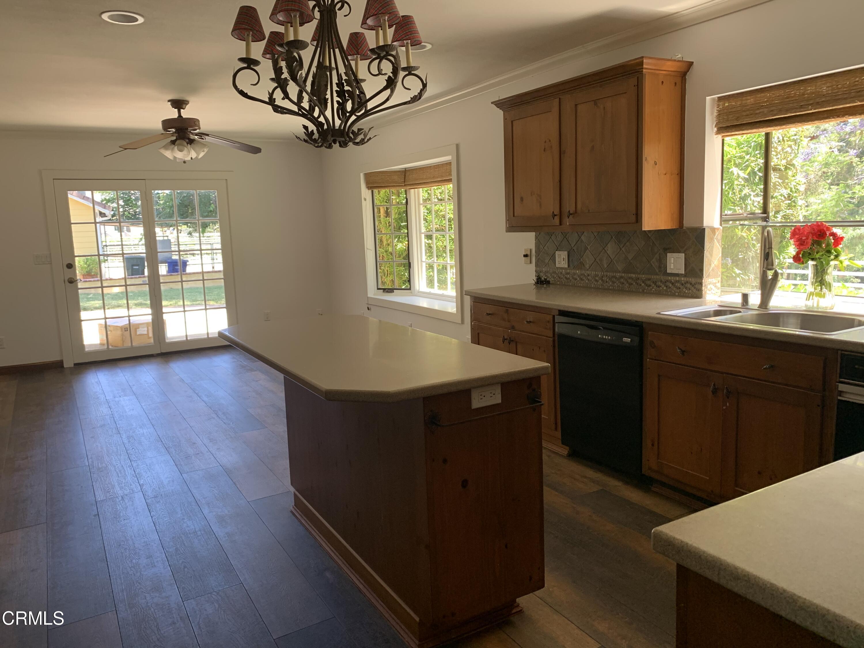 6009 La Cumbre Road Somis, CA 93066 - Photo 9 of 29 a kitchen with wooden floors and windows